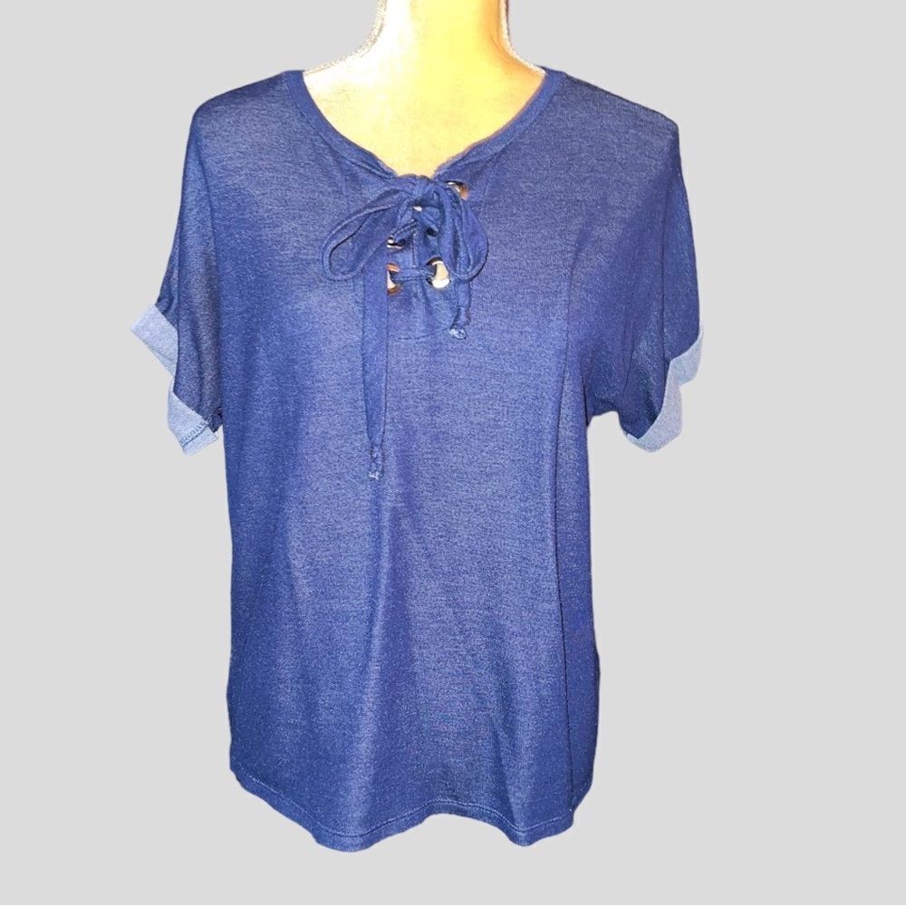 Femme denim color stretchy top! Cut grommets with tie front!
